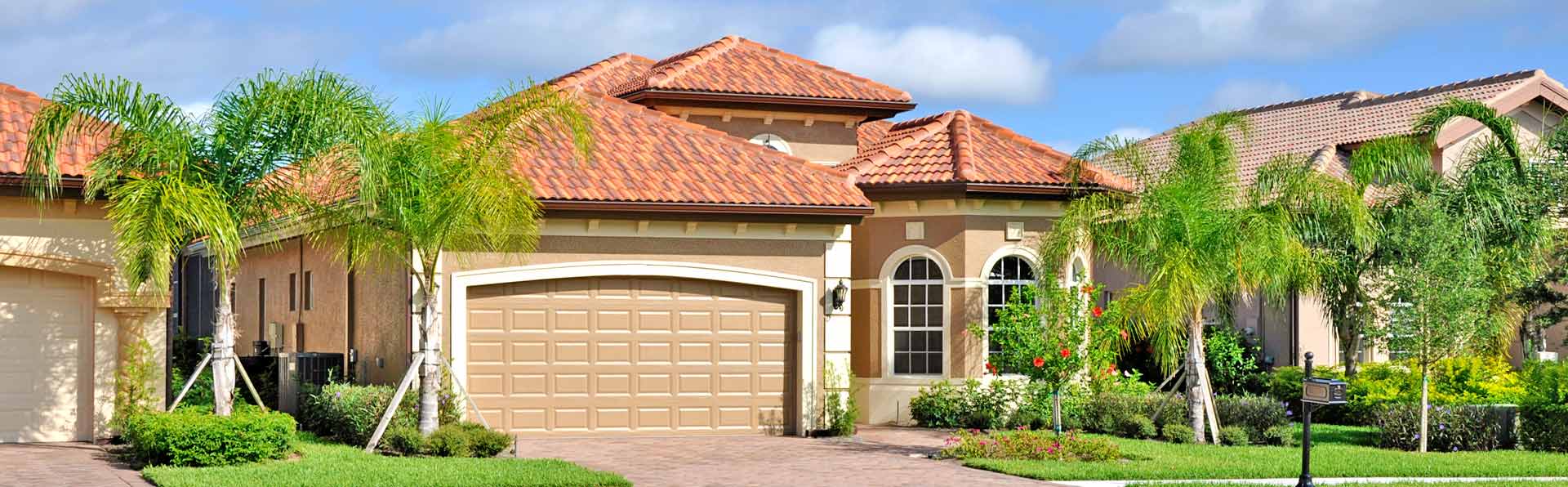 Tan Home with red tile roof
