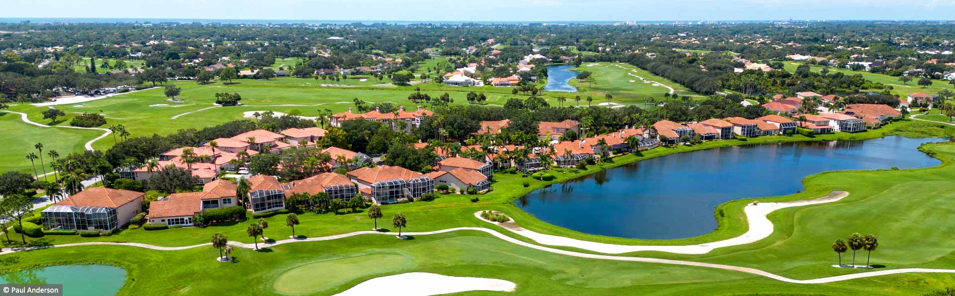 Florida style homes overlooking water and golf course