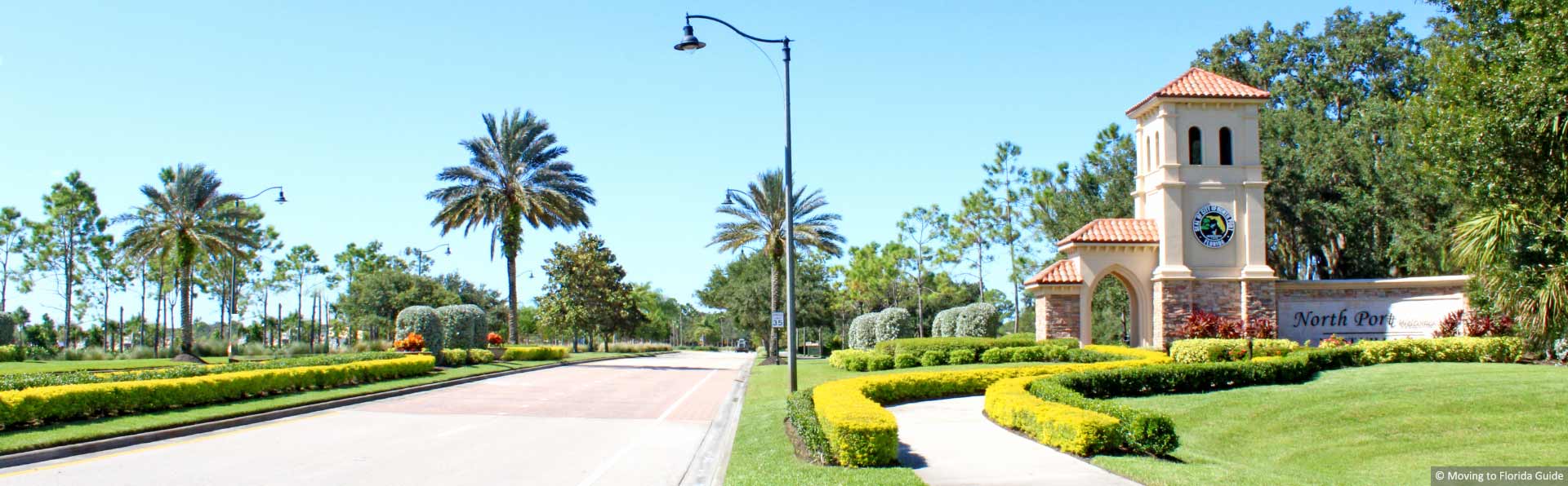 florida community entrance with bright tropical landscape