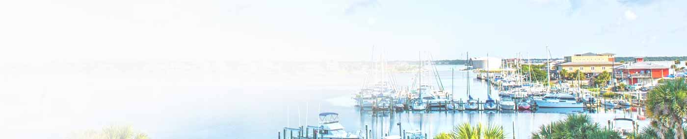 Sailboats and large homes on Pensacola Bay