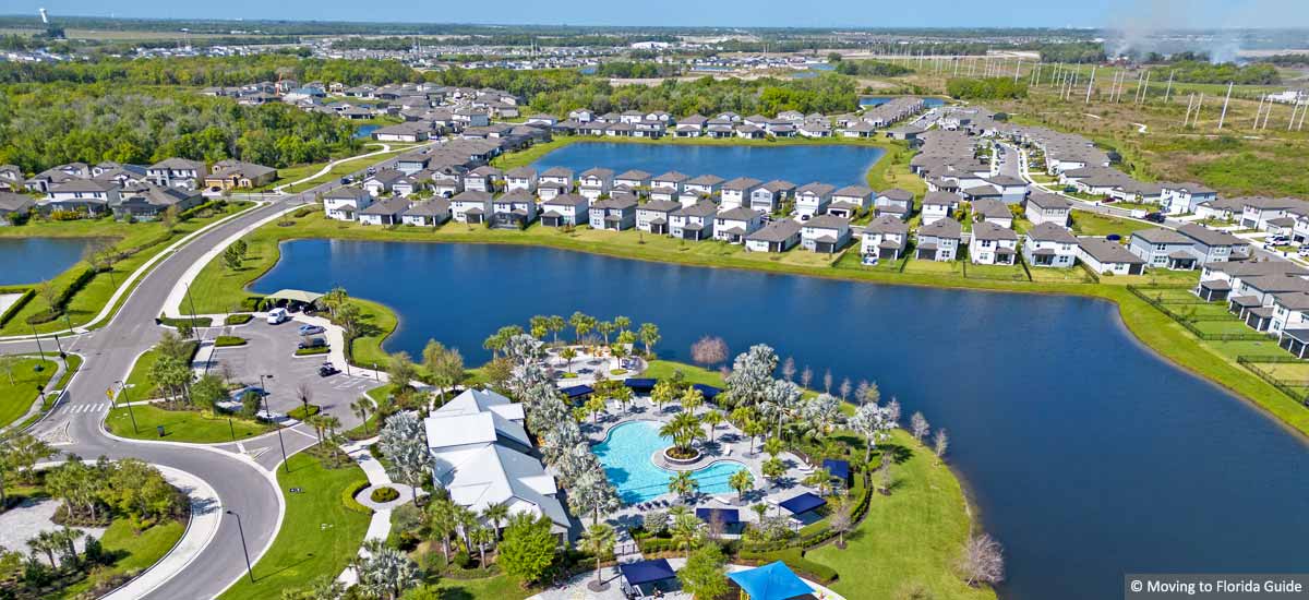 aerial view of florida homes overlooking a lake on a sunny day