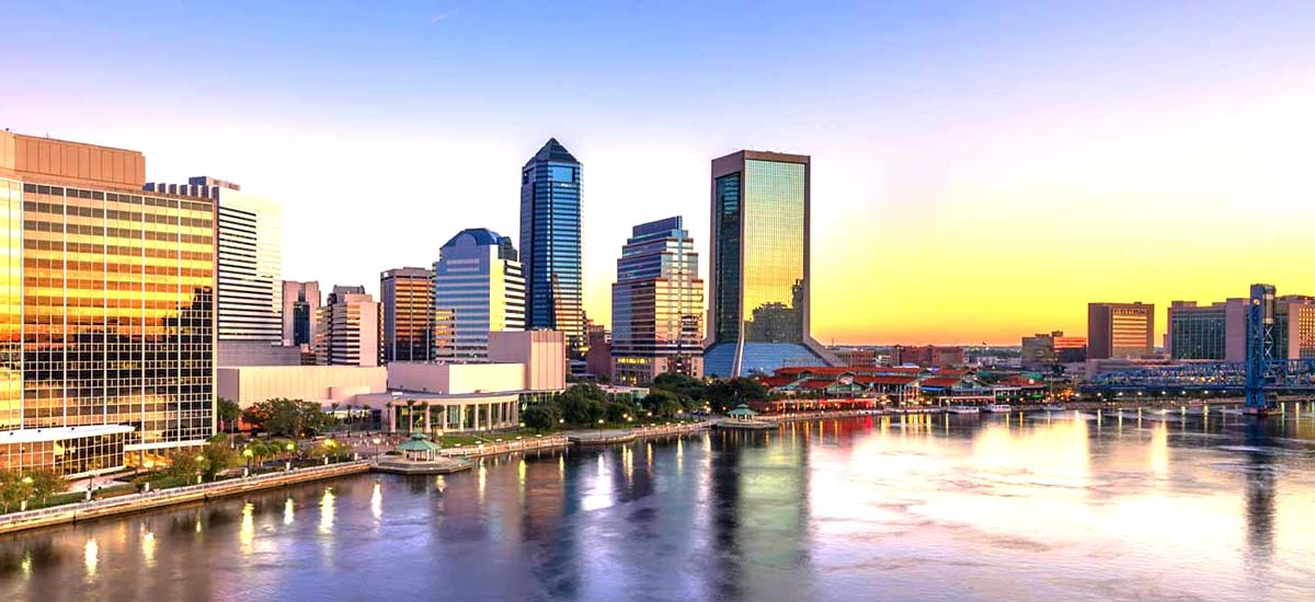 Jacksonville skyline of colorful city buildings at sunset