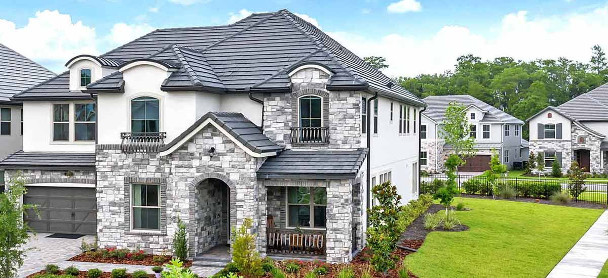 two-story Florida homes with gray tile roofs and landscape