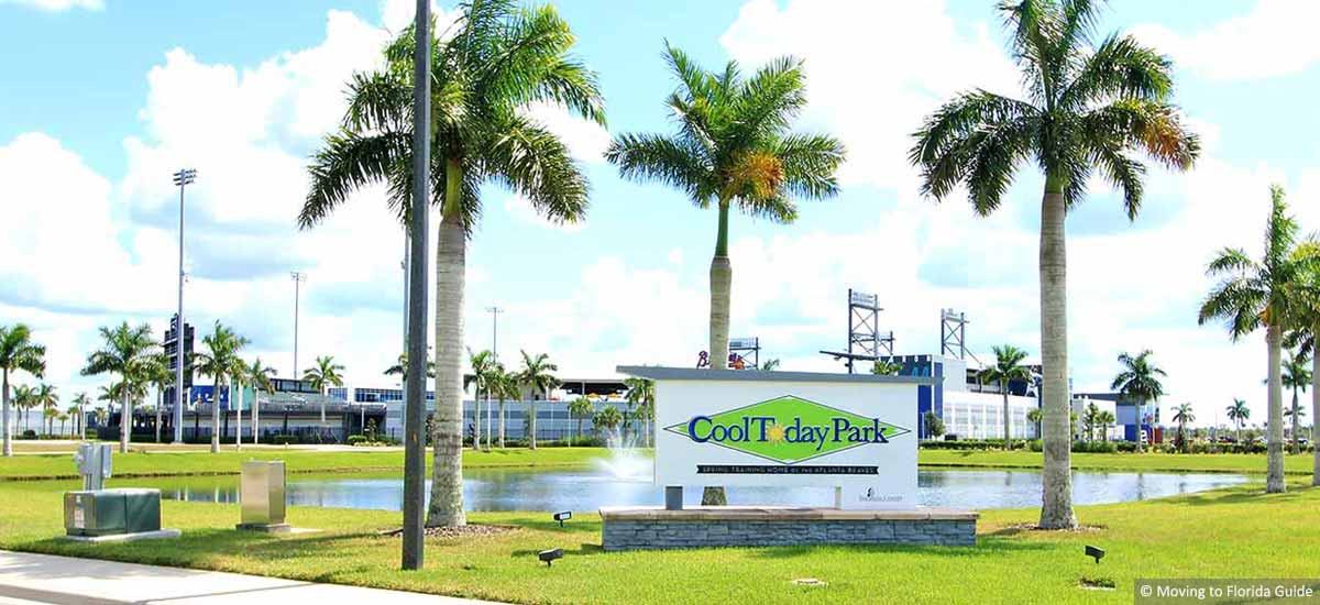 baseball park with sign and palm trees
