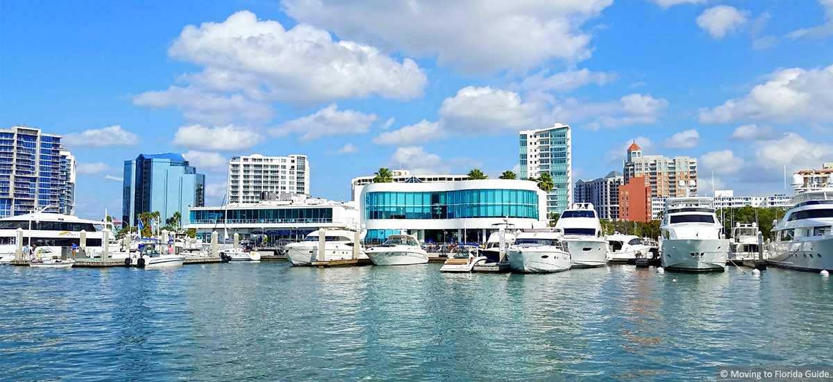 florida marina with tall buildings on a sunny day
