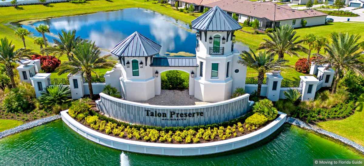 Community entrance with tropical landscape