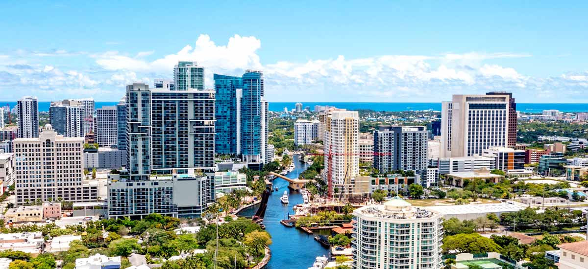 tall south Florida condo buildings next to waterway