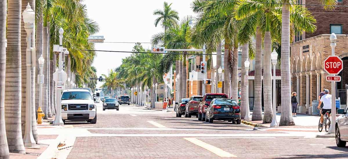 downtown Fort Myers lined with brick pavers and palm trees