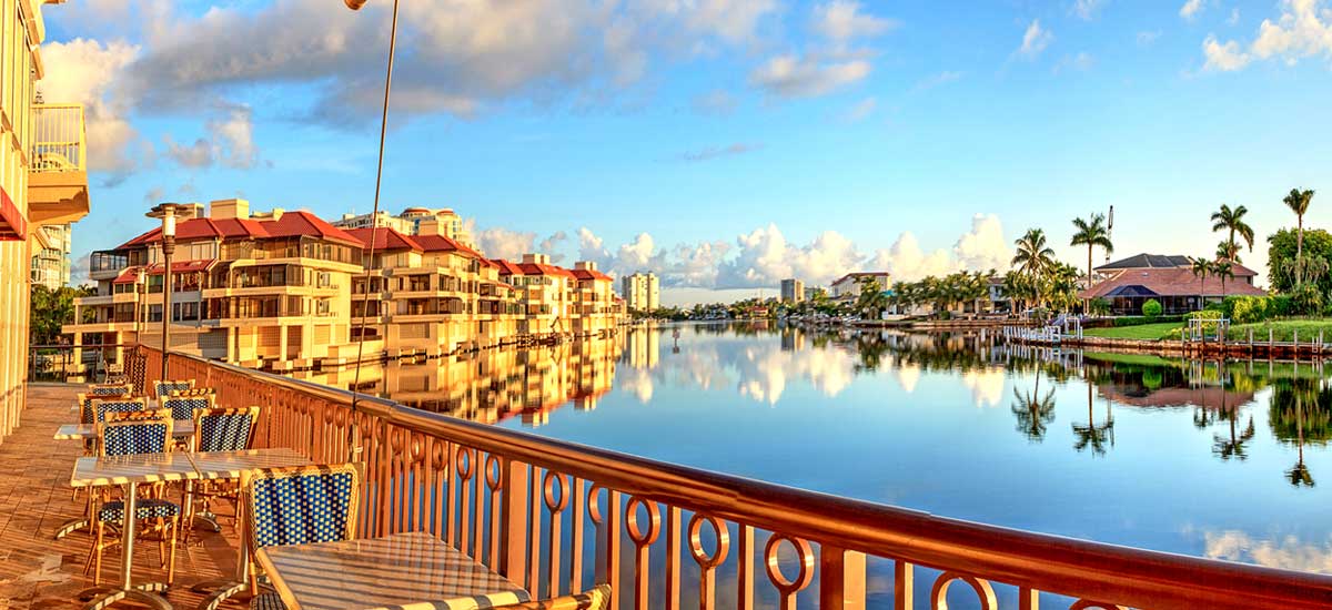sunset reflection of florida condos and homes on water