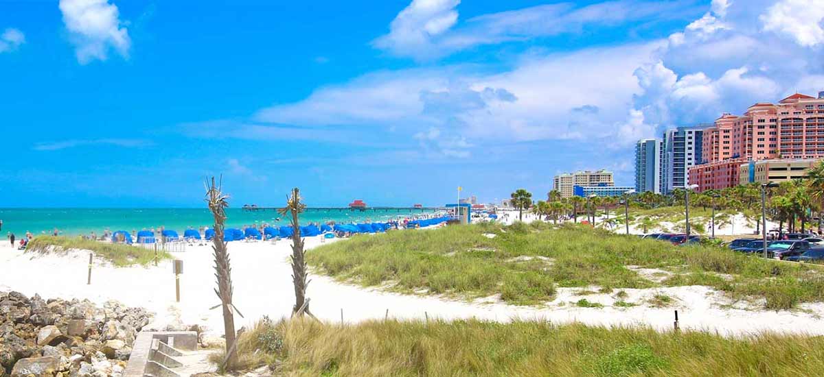hotels lining Clearwater beach on a partly cloudy day