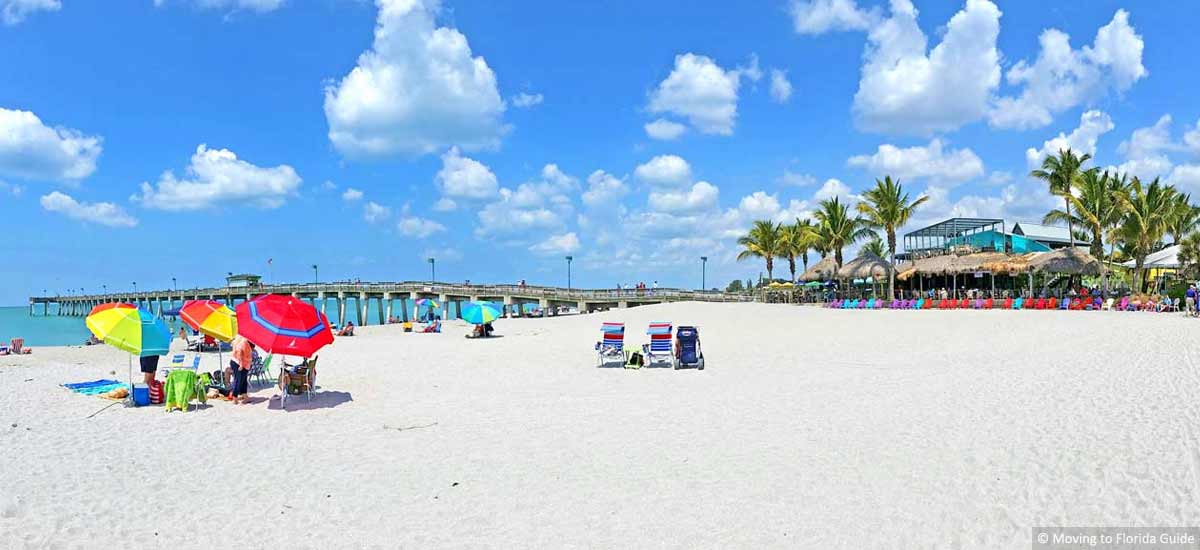 Florida beach with bright colored umbrelles and blue sky